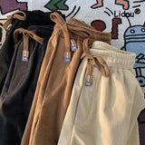 Casual Solid Color Korean Loose Straight Cylinder Sweatpants New Waist Drawcord Fashion Youth All-match Male Ninth Pants