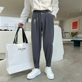 New Fashion Spring Summer Pants Men Tapered Bottom Slit Trousers Korean Style White Khaki Black Elastic Waist Casual Pants Man