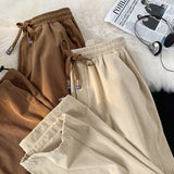 Casual Solid Color Korean Loose Straight Cylinder Sweatpants New Waist Drawcord Fashion Youth All-match Male Ninth Pants
